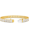 21CT TDW EMERALD CUT DIAMOND TENNIS BRACELET - 9CT GOLD