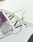 DAINTY CZ CROSS BRACELET - STERLING SILVER