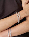 21CT TDW EMERALD CUT DIAMOND TENNIS BRACELET - 9CT GOLD