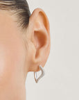 Wavy hoop earrings with zirconia